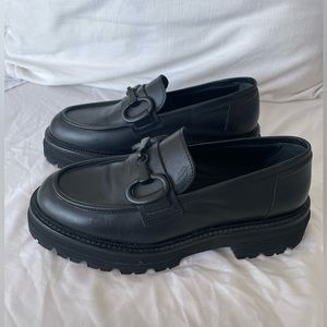 Black genuine Italian leather platform loafers with black hardware. Never worn